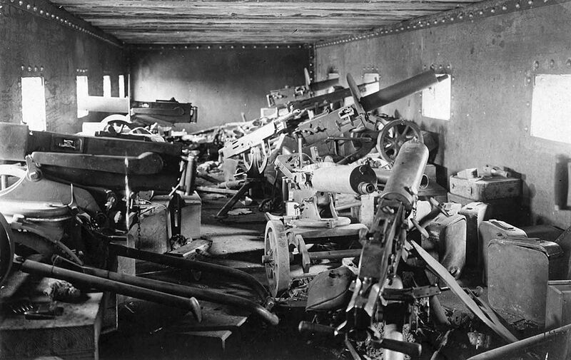 The interior of an armored train car, Chaplino, Dnipropetrovs'ka oblast, Ukraine, in the spring of 1918. At least nine heavy machine guns are visible, as well as many ammunition cases.