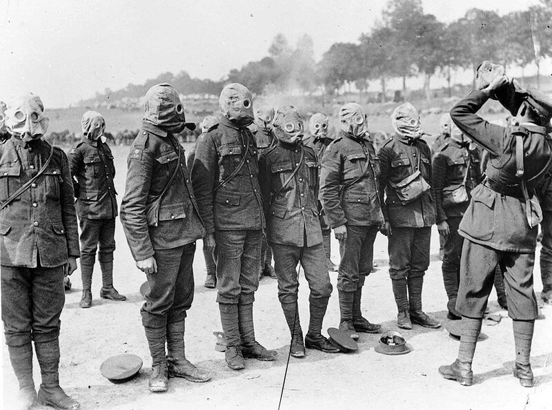 Irish Guards line up for a gas mask drill on the Somme, in September of 1916.