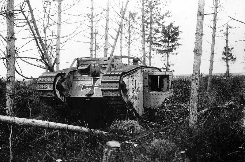 A British-made Mark IV tank, captured and re-painted by Germans, now abandoned in a small wood.