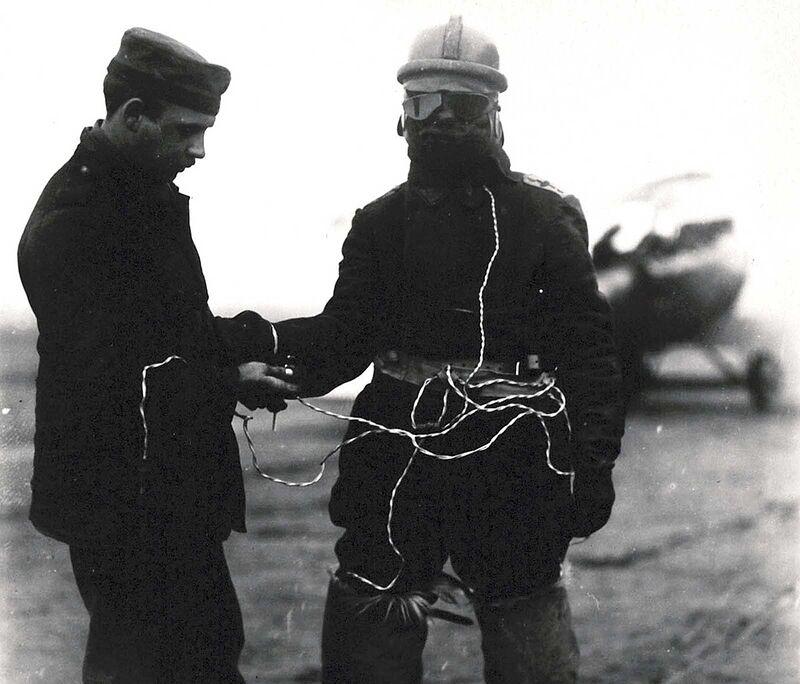 A German aviator's suit is equipped with electrically heated face mask, vest, and fur boots. Open cockpit flight meant pilots had to endure sub-freezing conditions.
