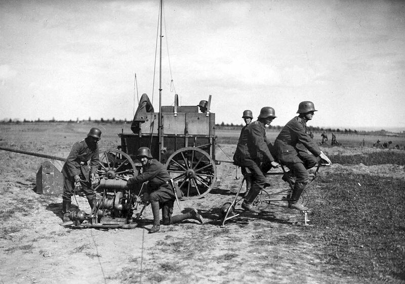 A German communications squad behind the Western front, setting up using a tandem bicycle power generator to power a light radio station in September of 1917.