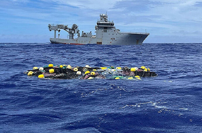 cocaine found bobbing in the Pacific Ocean with a ship in the background