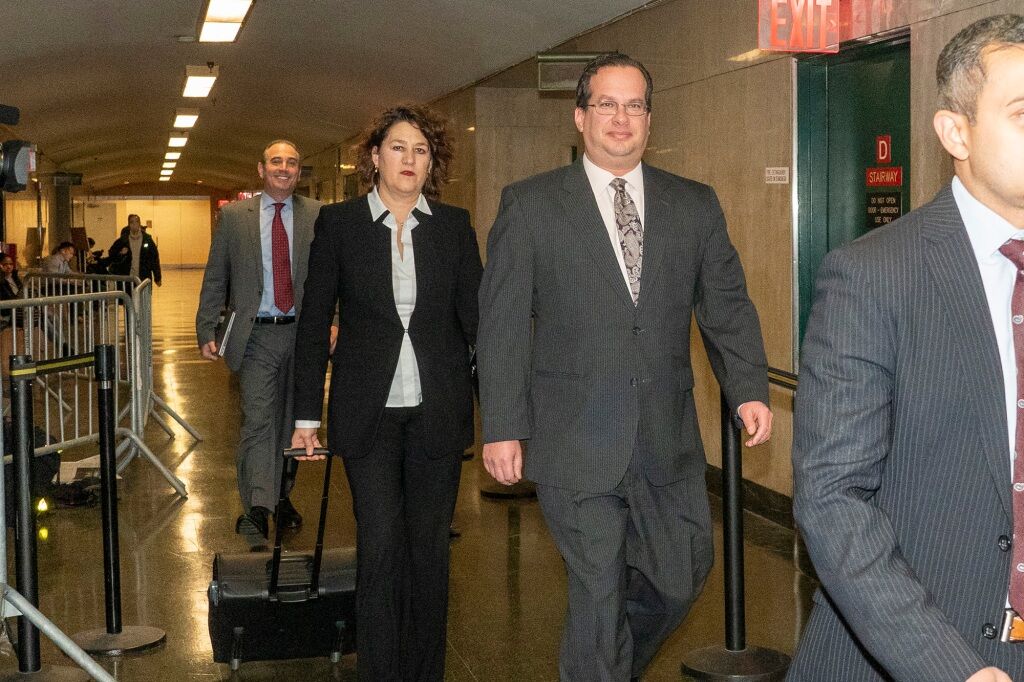 Assistant District Attorney Joshua Steinglass (right) entering court for the verdict.