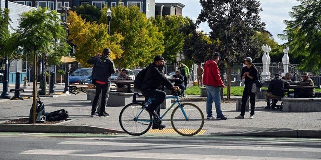 Pedestrians travel along Hayes Street in the Hayes Valley neighborhood of San Francisco, California, on November 2, 2022.