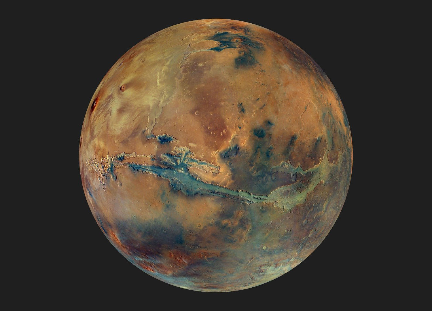 Enhanced-color Mars is more dull orange near the top right, with a darker brown area in the lower right, and a long greenish slash across the middle that is Valles Marineris.|1200x863.7362637362637